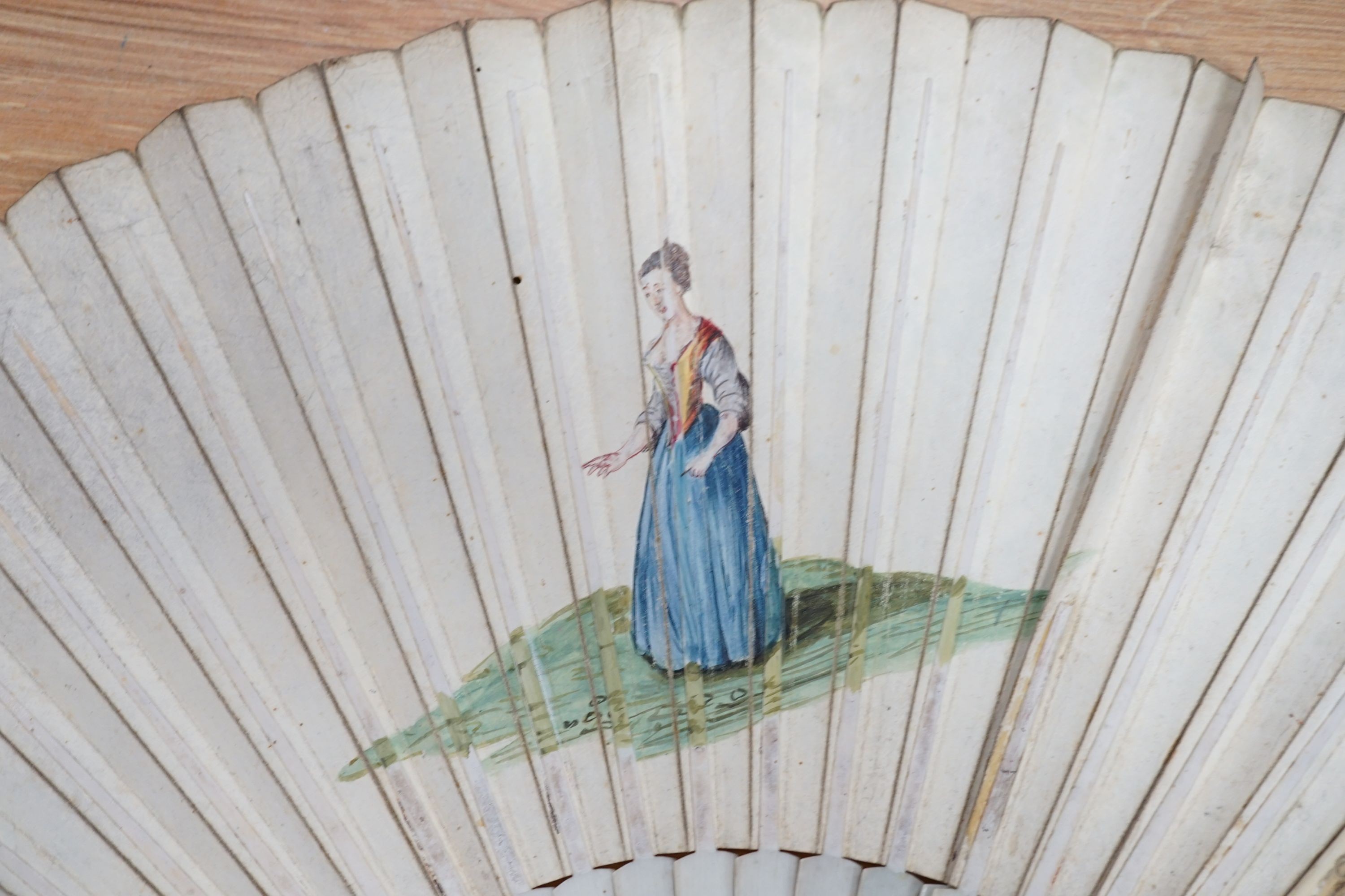 Five various fans, and an 18th century painted leaf fan with ivory chinoiserie decorated guards and sticks, 28 cms high (6)